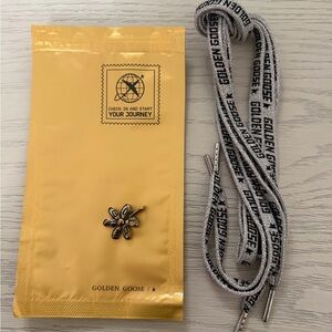 Golden Goose Silver and Black Shoelaces with gold Golden Goose Daisy Charm
